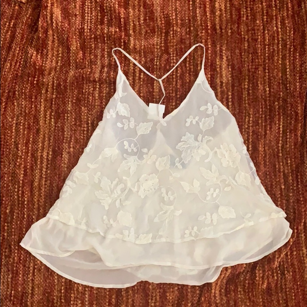 White flows top w/ stitched flowers